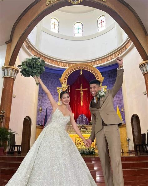 Vien Iligan stuns in her dainty wedding gown .